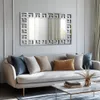 A modern living room with a sofa, mirror, and coffee table. Náhled obrázku produktu