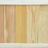A close-up view of several wooden planks arranged vertically, forming a textured background. Náhľad obrázku produktu