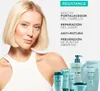 A woman with blonde hair is shown next to several Kérastase hair products. Text overlays highlight the product's benefits. Produktbild-Vorschau