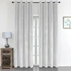 A room interior with a window covered by white curtains, a bedside table with a lamp, and a framed picture on the wall. Produktbild-Vorschau