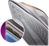 Close-up of the soleplate of a Philips steam iron, with an inset showing the layered construction of the soleplate. Voir les images du produit