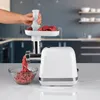 A person is using a white meat grinder in a kitchen setting. Anteprima dell’immagine prodotto