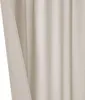 A close-up view of a beige curtain, showing its texture and folds. Produktbild-Vorschau