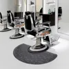 A salon or barber shop setting with multiple styling chairs and a floor mat. Náhled obrázku produktu