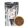 A bag of Belgian milk chocolate drops next to a wooden bowl filled with the same chocolate drops. Produktbild-Vorschau