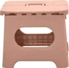 A pink foldable stool against a white background. Produktbild-Vorschau