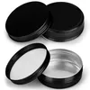 Two black screw-top aluminum tins are shown against a white background. One tin is open, revealing its silver interior and white liner. The other tin is closed and positioned behind it. Produktbild-Vorschau