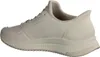 A side view of a white Skechers sneaker. Voir les images du produit