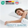 A woman sleeping peacefully on a mattress. Produktbild-Vorschau