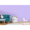 A child's room with a sofa, storage bags, and a rocking horse. Produktbild-Vorschau