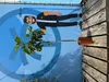 A potted fig tree is shown in front of a large blue banner with a cartoon illustration of a man and a height measurement. Produktbild-Vorschau