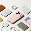 A collection of phone accessories, including cases, chargers, and card holders, arranged on a white background. Produktbild-Vorschau