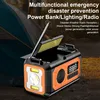 A multifunctional emergency device is shown in a camping setting with a tent in the background. Podgląd zdjęcia produktu