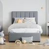 A child's bed with bedding and stuffed animals in a room. Produktbild-Vorschau