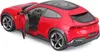 A red Ferrari Purosangue model car with the driver's side door open, shown from a three-quarter rear angle. Podgląd zdjęcia produktu
