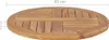 A close-up view of a round teak tabletop, showing its wood grain and construction. Dimensions are indicated with text overlays. Voir les images du produit