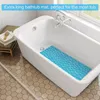 A blue bathtub mat is placed inside a white bathtub. Produktbild-Vorschau