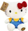 A plush toy of Hello Kitty sitting down, wearing blue overalls and a yellow shirt. Anteprima dell’immagine prodotto