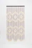 A beaded curtain hanging against a white background. Podgląd zdjęcia produktu