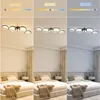 A collage showing a modern LED ceiling light with four rings in a bedroom setting, demonstrating different color temperatures. Voir les images du produit