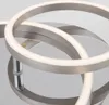 A close-up view of a modern LED ceiling light with interlocking rings. Produktbild-Vorschau
