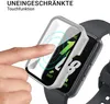 A hand is shown touching a smartwatch with a protective case being applied. Produktbild-Vorschau