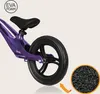 Close-up of the rear wheel and frame of a purple balance bike, with a magnified view of the EVA foam material. Produktbild-Vorschau