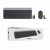 A Logitech MK470 Slim Combo keyboard and mouse set is displayed on a white background, along with two AA batteries and a USB receiver. Produktbild-Vorschau