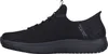 A side view of a black Skechers shoe. Voir les images du produit