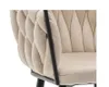 Close-up of a beige upholstered chair with a braided design on the backrest and a black metal frame. Podgląd zdjęcia produktu