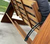 Close-up view of the wooden frame and metal mechanism of a swing chair. Podgląd zdjęcia produktu