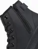 A close-up view of the side of a black boot, showing the lacing and zipper details. Anteprima dell’immagine prodotto
