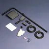A flat lay of a black shower system kit laid out on a blue background. Podgląd zdjęcia produktu