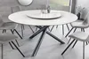A modern dining room with a round marble-look table and chairs. Produktbild-Vorschau
