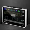 A digital oscilloscope is displayed on a dark surface, with a dark background. The screen shows waveform data and menu options. Náhled obrázku produktu