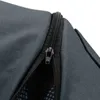 A close-up view of a zipper on a gray fabric product. Náhled obrázku produktu