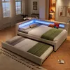 A bedroom scene with a modern bed and a pull-out bed. Produktbild-Vorschau