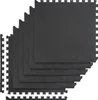 A stack of black interlocking puzzle mats. Voir les images du produit