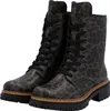 A pair of leopard-print combat boots. Voir les images du produit