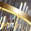 Close-up of a modern chandelier with crystal prisms and a gold band. Náhľad obrázku produktu