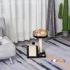 A cat sleeping on a cat tree in a living room. Anteprima dell’immagine prodotto