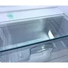 Close-up view of an empty refrigerator drawer with a glass shelf. Produktbild-Vorschau