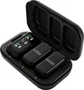 A black charging case with a Rode Wireless Micro Camera Kit inside. The case is open, revealing two transmitters and a receiver with a screen. Voir les images du produit