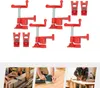 A set of red pipe clamps on a white background. Produktbild-Vorschau