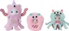 Three small, plush monster toys with animal-like faces, each wearing a different monster costume. Podgląd zdjęcia produktu