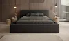 A modern bedroom with a large bed as the focal point. Voir les images du produit