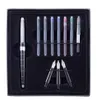 A calligraphy set with a pen, ink cartridges, and nibs laid out in a black case. Produktbild-Vorschau