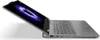 A laptop computer is shown from a side-angle, with the screen open and displaying a graphic. Produktbild-Vorschau