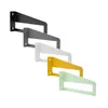 Four metal shelf brackets in different colors are arranged diagonally against a white background. Podgląd zdjęcia produktu