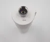 A top-down view of a white water filter with a silver connector on top. Voir les images du produit